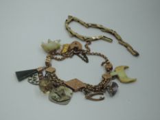 A yellow metal composite bracelet having padlock clasp stamped 9ct, various charms including white &