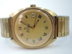 A gent's Bulova Accutron wrist watch having Roman numeral dial with date aperture to champagne