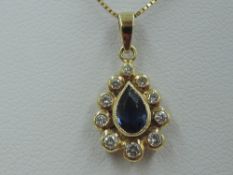 A sapphire and diamond teardrop cluster pendant in a yellow metal mount, marks worn, probably 18ct