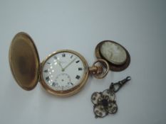 A gold plated hunter pocket watch by Limit, a conch shell cameo in rolled gold case and rolled