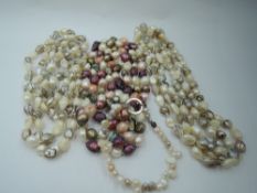 Two long strings of white, grey and tiger stripe baroque pearls, a long string of multi coloured