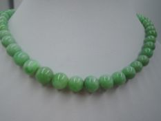 A string of graduated jade beads (later restring), approx 20'