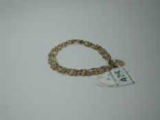 A 9ct gold four bar gate bracelet having padlock clasp, approx 5.4g