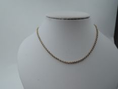 A yellow metal belcher chain stamped 14K, approx 22' & 7.1g