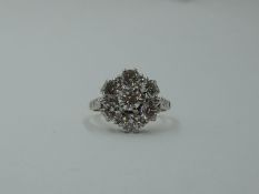 A diamond daisy cluster dress ring, total approx 2ct in a claw set stepped mount to diamond set