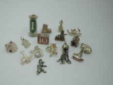 Sixteen HM silver and white metal charms including cased £1 & £10 notes, hedgehog, dog kennel,