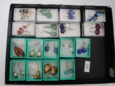 Nineteen pairs of fashion loop drop earrings of various forms including glass, mineral, hematite