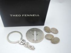 A silver key ring by Theo Fennell bearing the emblem and a pair of silver cufflinks also by Theo