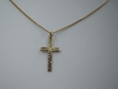 A 9ct gold cross and chain having engraved decoration, approx 15' & 2.4g (chain AF)