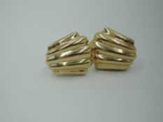 A pair of American 14ct gold clip earrings in moulded scalloped form, approx 5.7g