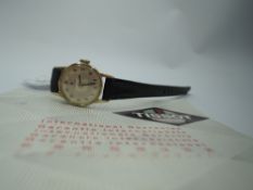 A lady's 1960's 9ct gold wrist watch by Tissot having Arabic numeral dial in a gold case on a
