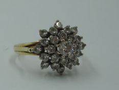 A diamond multi stone cluster ring, total approx 1ct in a stepped claw set basket mount to split
