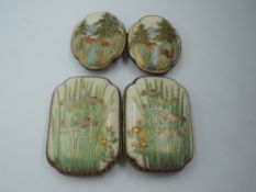 A Satsuma ware buckle having white metal back stamped FS and iris and reed decoration to cream