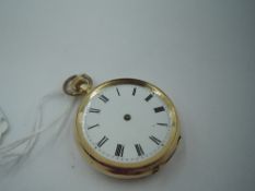 A yellow metal top wound pocket watch stamped 14K having Roman numeral dial, missing pointers, in