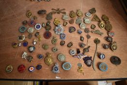 A collection of WW1 and later mainly Military Badges and Tinnies including silver ARP, British