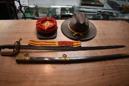 A reproduction American CSA Sword with scabbard, Reproduction CSA Cap Badge, Reproduction