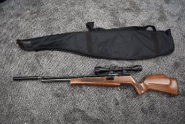 A Falcon SWP 2700 PSI .22 cal 94937 Air Rifle with silencer and Webley 4 x 40 scope fitted, in
