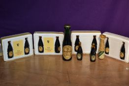 Eleven miniature bottles of Guinness, some in polystyrene presentation
