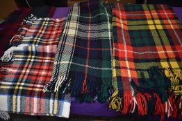 A collection of vintage tartan rugs.