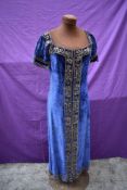 A 1920s/30s blue velvet dress having extensive metal thread work and sequins throughout.
