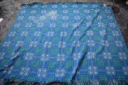 A blue,white and green Welsh wool blanket 'A dyffryn product,Cymryu am Byth'.