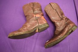 A pair of vintage American cowboy boots in oxblood.