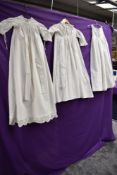 Three Victorian childrens gowns, broderie anglais and pin tuck details to hems of some.