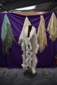 A collection of vintage and antique shawls including mint green fringed shawl,another of silk having