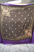 An early 20th century embroidered canton shawl having extensive fringing.