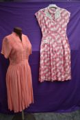 Two 1940s day dresses, one having honeycomb smocking to front the other with white lattice