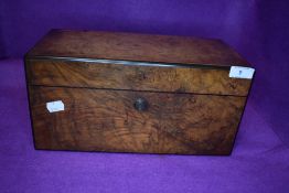 A fine Victorian tea caddy having walnut burr inner and outer casing with original silvered interior