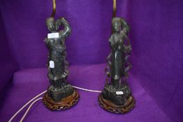 A pair of mid century soap stone carved table lamps of oriental geisha or similar with shades