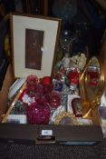 A selection of cranberry glass and similar decorations