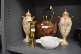An antique copper and brass stove kettle with similar flower vase and two mantle urns