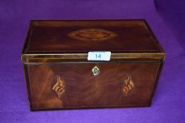 A Victorian tea caddy having mahogany and inlaid case with lidded twin compartment inner
