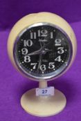 An atomic styled alarm clock Rhythm having space age style design