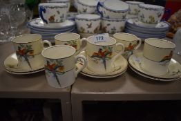A selection of mid century style coffee canisters having parrot design