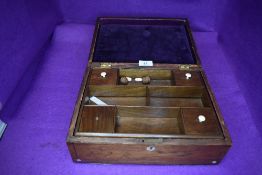 An antique haberdashery or sewing box having compartmental inner with brass and mother of pearl