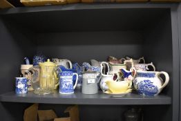 A selection of various water cream and milk jugs including blue and white wear, chintz and