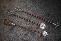 Three fold out shooting sticks including leather seated