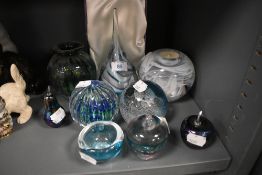 A selection of studio art glass including Caithness paper weights and lustre apples including Adrian