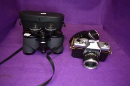 A pair of Greenkat De Luxe 8x40 binoculars and a Kowa film camera both having cases