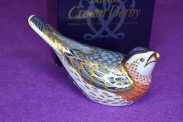 A ceramic Royal Crown Derby paper weight or figure of a Bluebird having gold stopper and box