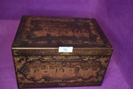 An late Victorian Japan lacquer tea caddy having highly decorated outer with pewter inner container