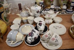 A selection of tea cups and saucers with matching tea pots including Royal Albert Royal Doulton