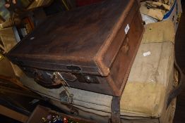 A vintage leather bound luggage case and similar military utility case