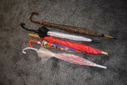 Five umbrellas including childrens and perspex