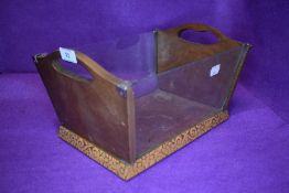 An art deco fruit bowl having glass sides and carved decoration