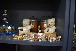 A selection of collectable Wade Whimsies figures, also two small teddy bears and two oak biscuit