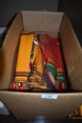 A pair of linen style curtains and a selection of fabrics